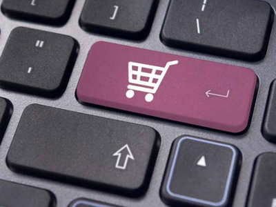An image of a shopping cart on a keyboard.
