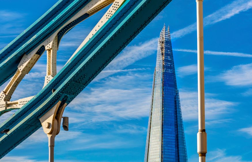 A skyscraper with a clear blue sky