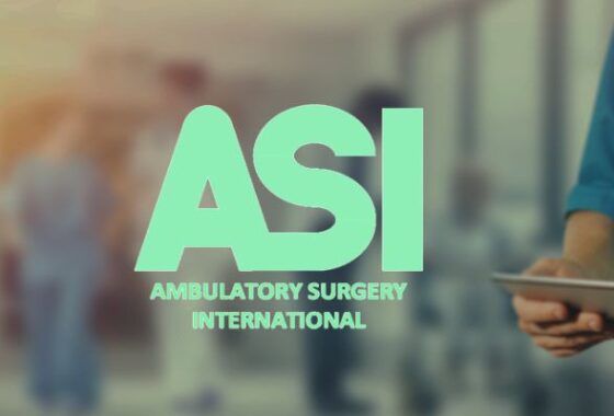 The logo for Ambulatory Surgery International in sky blue, a blurred image of a busy hospital ward as the background.