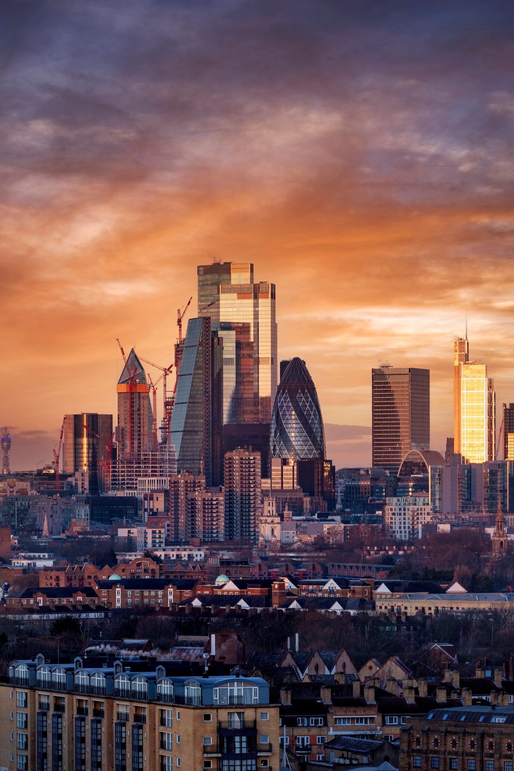 The City of London skyline, as seen from a high point in the evening.