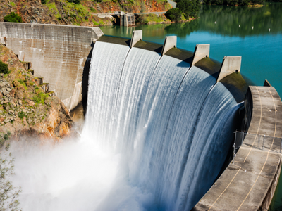 A dam with water coming out of it.