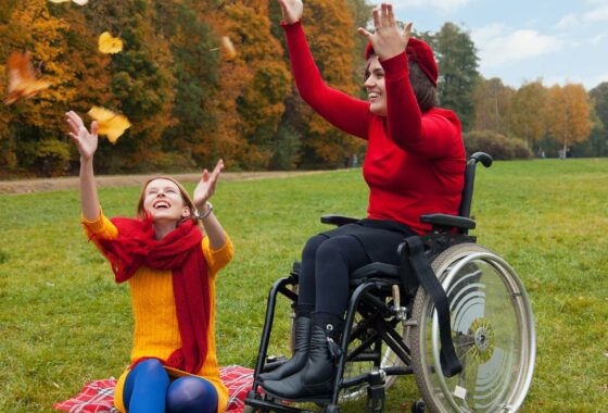 Disabled ladies celebrating finding a new Infor SunSystems partner