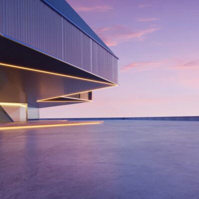 A modern building at dusk with a view of the sky.