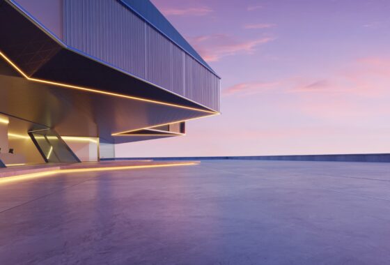 A modern building at dusk with a view of the sky.