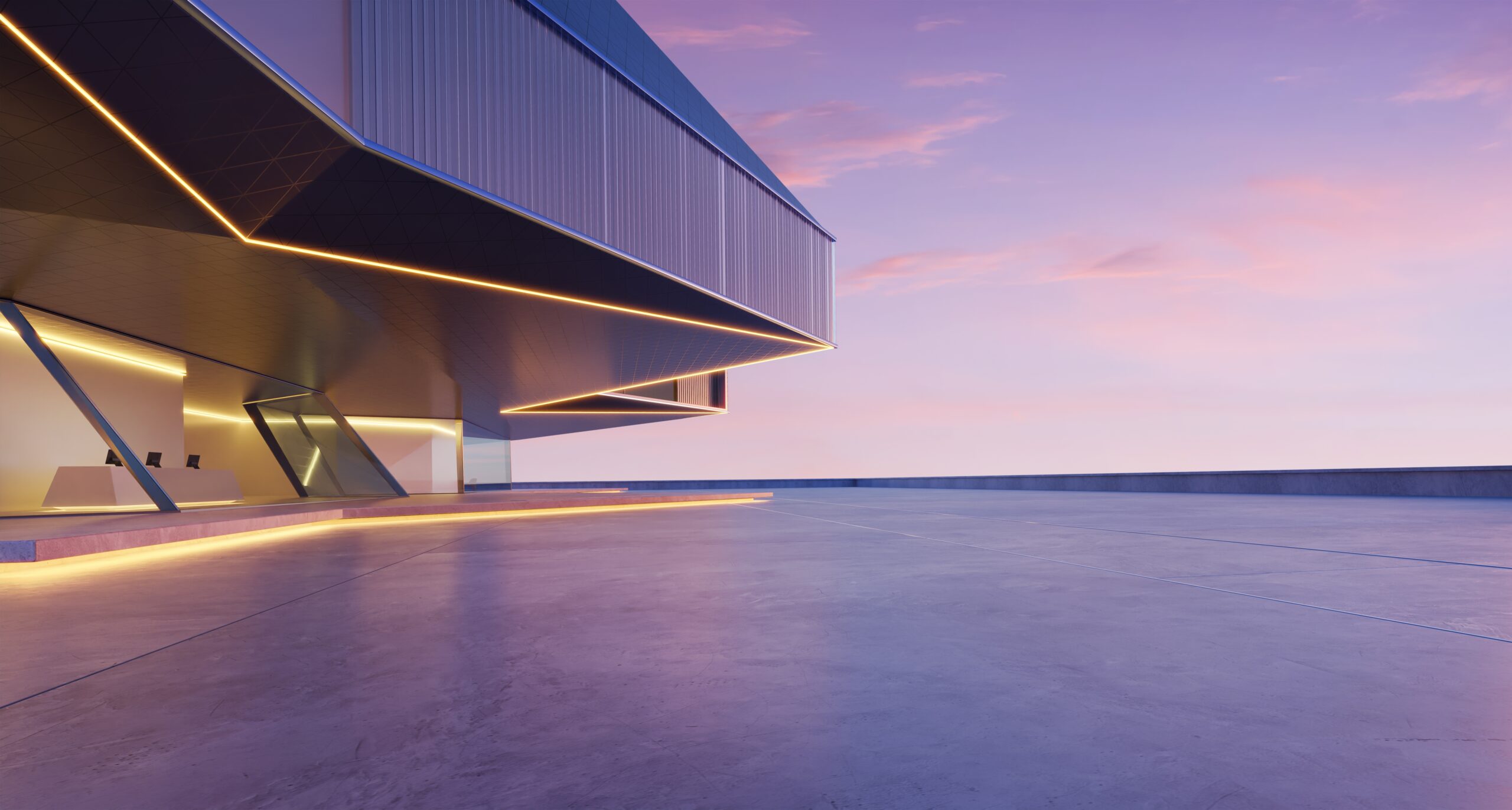 A modern building at dusk with a view of the sky.